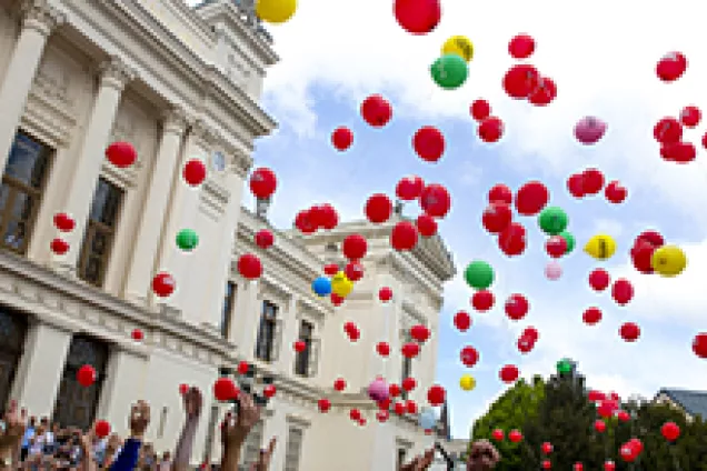 Balloons escape into the air.